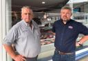 New owner Rhodri Davies and shop manager Louis Mostert