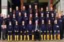 Penarth RNLI crew. The arrows highlight the members honoured for long service