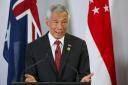 Singapore Prime Minister Lee Hsien Loong will stand down next month (AP)