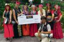 BELLY DANCERS: Ommadom presenting a cheque to Tenovus (8473232)