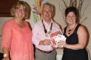 EXCELLENT EVENING: Club president Colin Jones receiving some of the public information booklets from Catherine Campbell and Jayne Rookes of the BHF. (8699796)