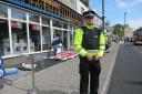 SIGN FALLING: Police cordoned off the area where the shop sign fell