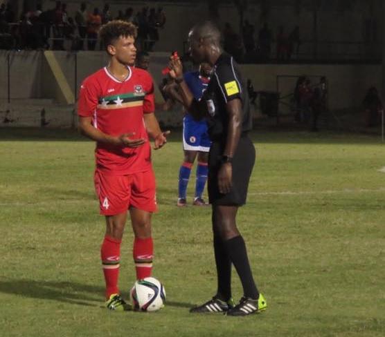 DEBUT: Cwmbran's Theo Wharton takes instruction from the referee while playing for St Kitts & Nevis against Haiti