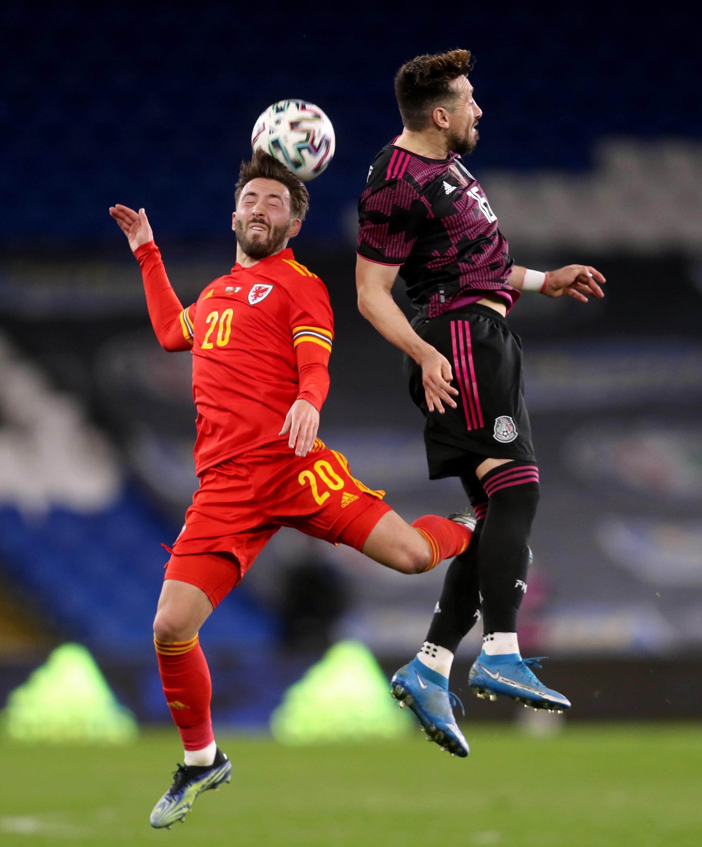 Wales Josh Sheehan (left) and Mexicos Hector Herrera battle for the ball during the international friendly at the Cardiff City Stadium, Cardiff. Picture date: Saturday March 27, 2021..