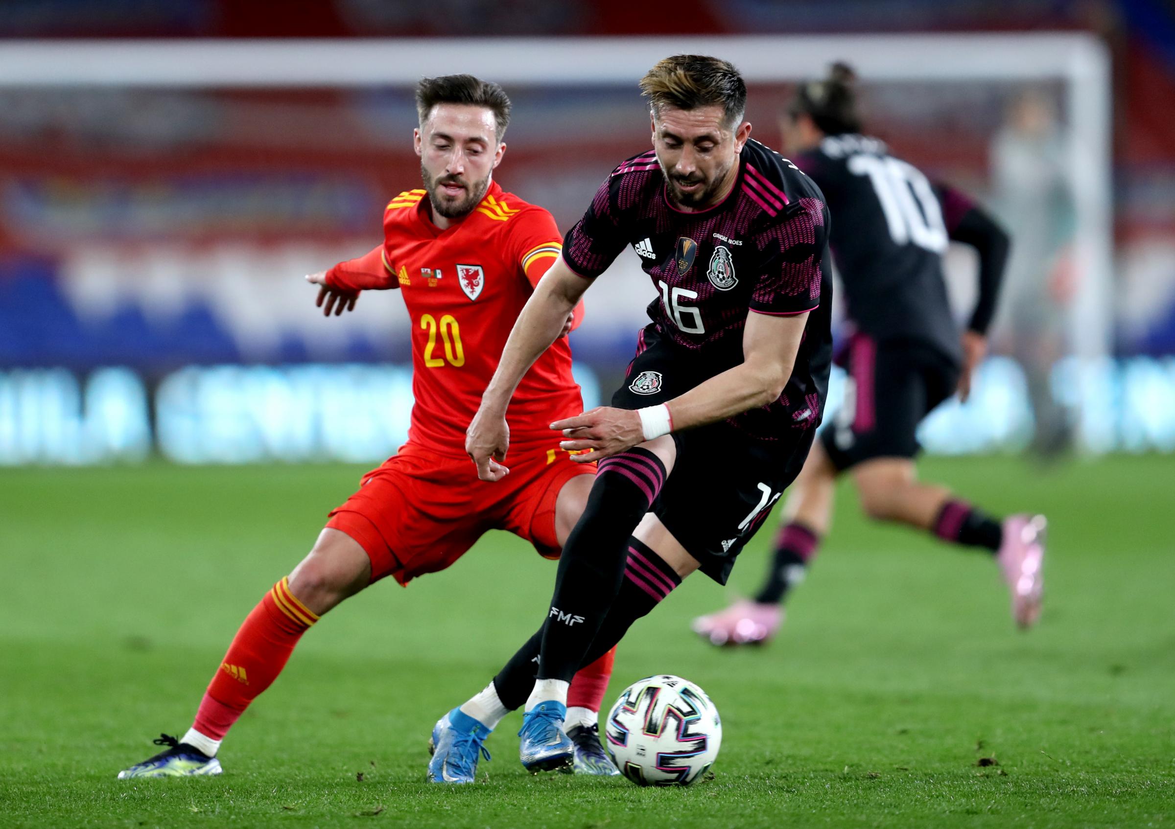 Wales Josh Sheehan (left) and Mexicos Hector Herrera battle for the ball during the international friendly at the Cardiff City Stadium, Cardiff. Picture date: Saturday March 27, 2021.