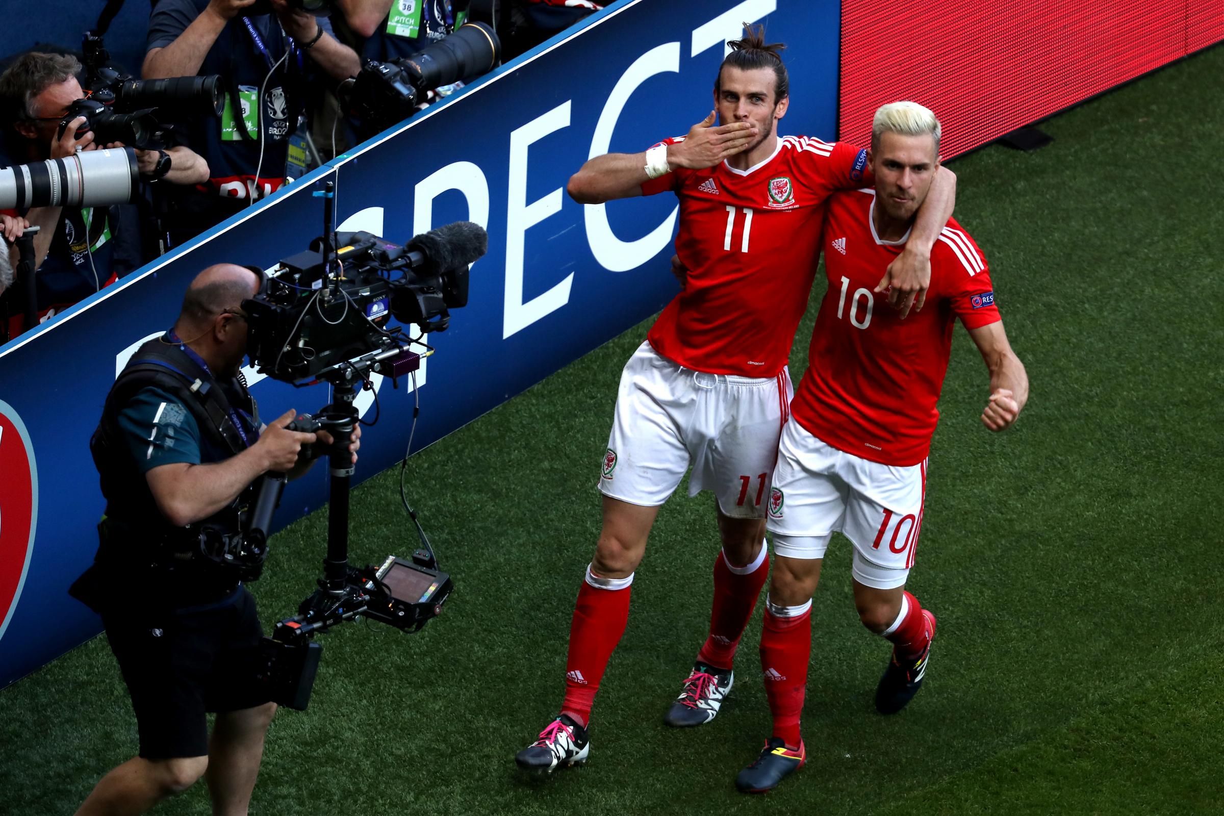 Gareth Bale (left) celebrates with teammate Aaron Ramsey after the goal against Northern Ireland at Euro 2016