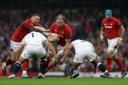 Wales' Alun Wyn Jones (centre) is tackled by England's Ben Moon (left) and Kyle Sinckler during the Guinness Six Nations match at the Principality Stadium, Cardiff. PRESS ASSOCIATION Photo. Picture date: Saturday February 23, 2019