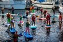 Paddle boarders surprised photographers in Penarth last weekend