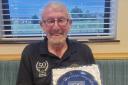 Old Penarthians RFC's honorary treasurer Nigel Williams wearing his commemorative shirt and holding a specially designed Rumney Pottery plate