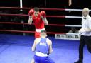 Haaris Khan (red) was amazed by his experiences in the Commonwealth Games despite an early loss