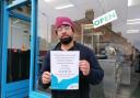 Osman Khan, manager of Penarth Fish Bar receives certificate of appreciation f