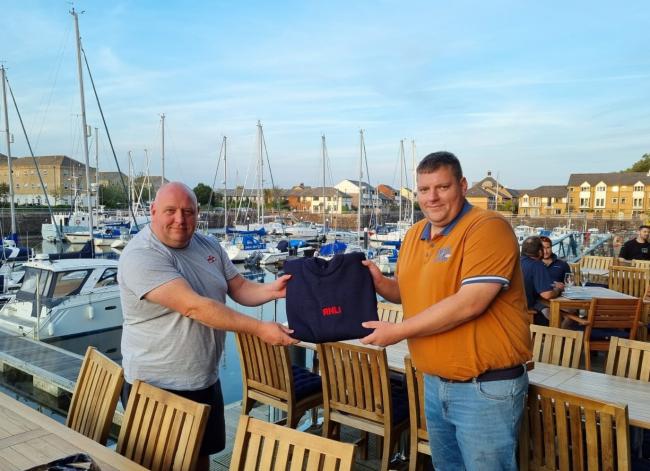 Cliff Taylor being presented his RNLI Guernsey jumper by Lifeboat Operations Manager Jason Dunlop (Picture: RNLI Penarth)
