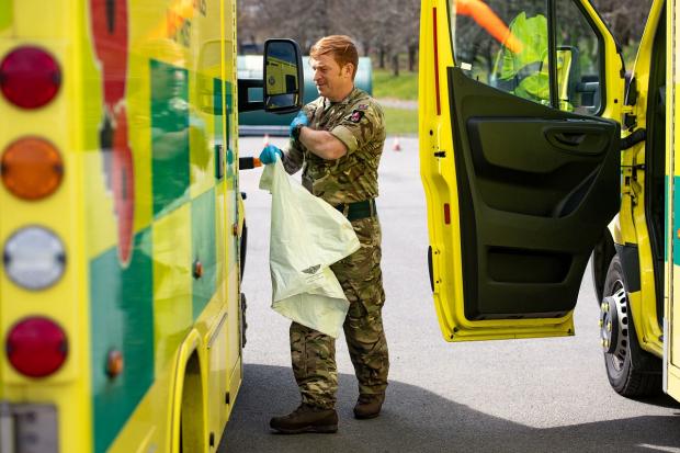 Penarth Times: Members of the British Army during training in April 2020 to support the Welsh Ambulance Service in the battle against Covid-19. Picture: Via PA