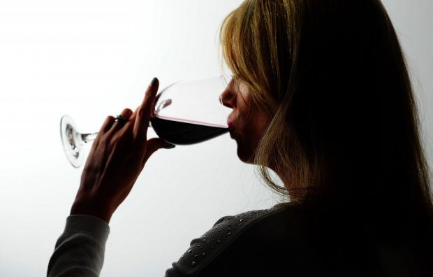 Penarth Times: A woman drinking red wine. Credit: PA