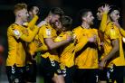DELIGHT: County celebrate their 1-0 win earned by Cameron Norman's late hit