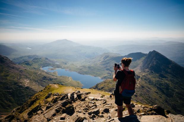 Penarth Times: A hiker on Yr Wyddfa (Picture: VisitWales)