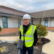 Welsh rugby legend Sir Gareth Edwards gets stuck  in at new hospital garden