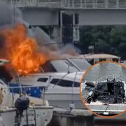 Boat engulfed in flames as firefighters battle to put out blaze