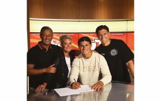Louis Rees-Zammit signs three year contract with Kansas City Chiefs alongside parents Joseph Zammit (L), Maxine Rees-Zammit and brother Taylor Rees-Zammit
